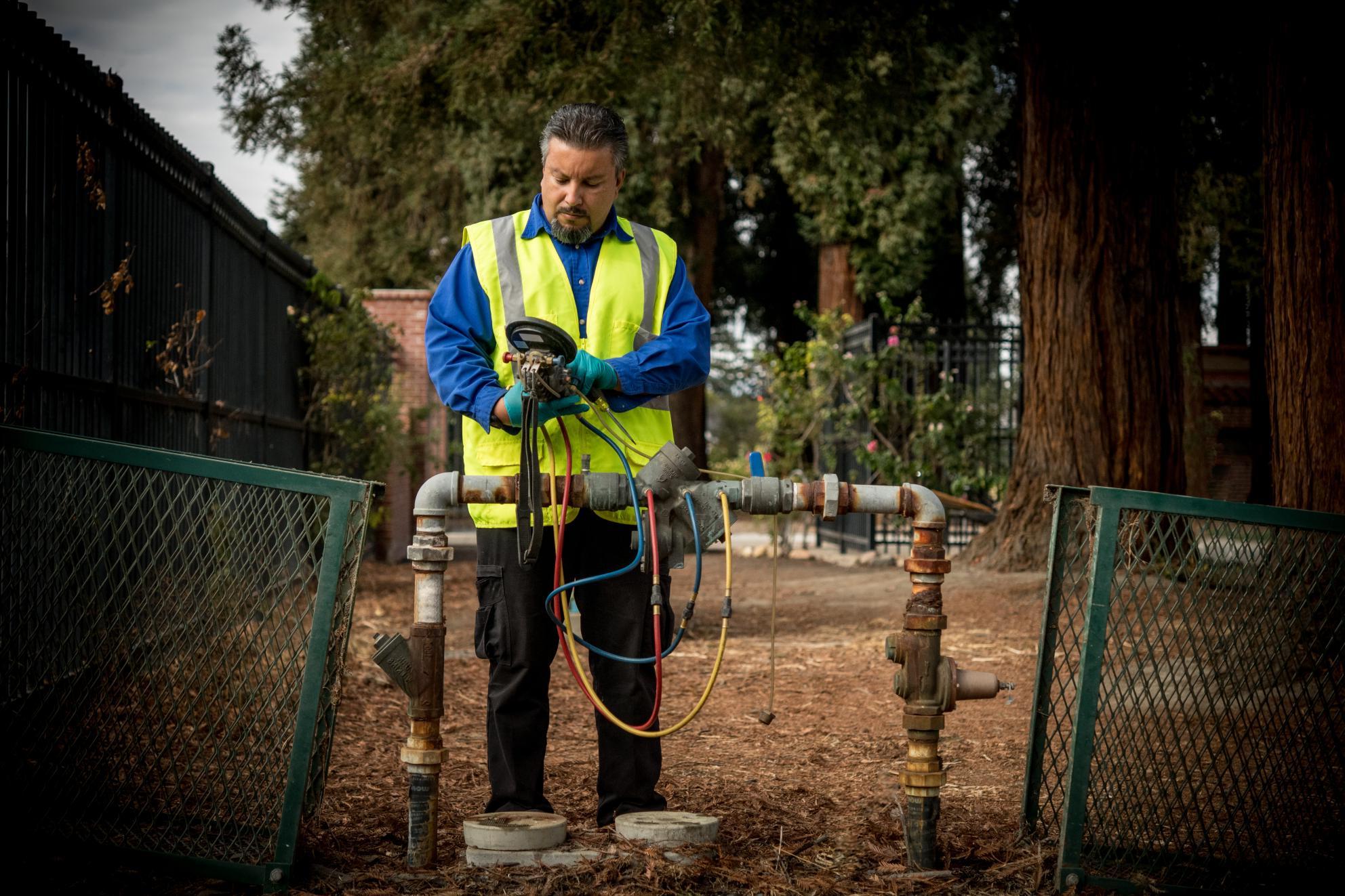 Technician Analyzing Water Backflow